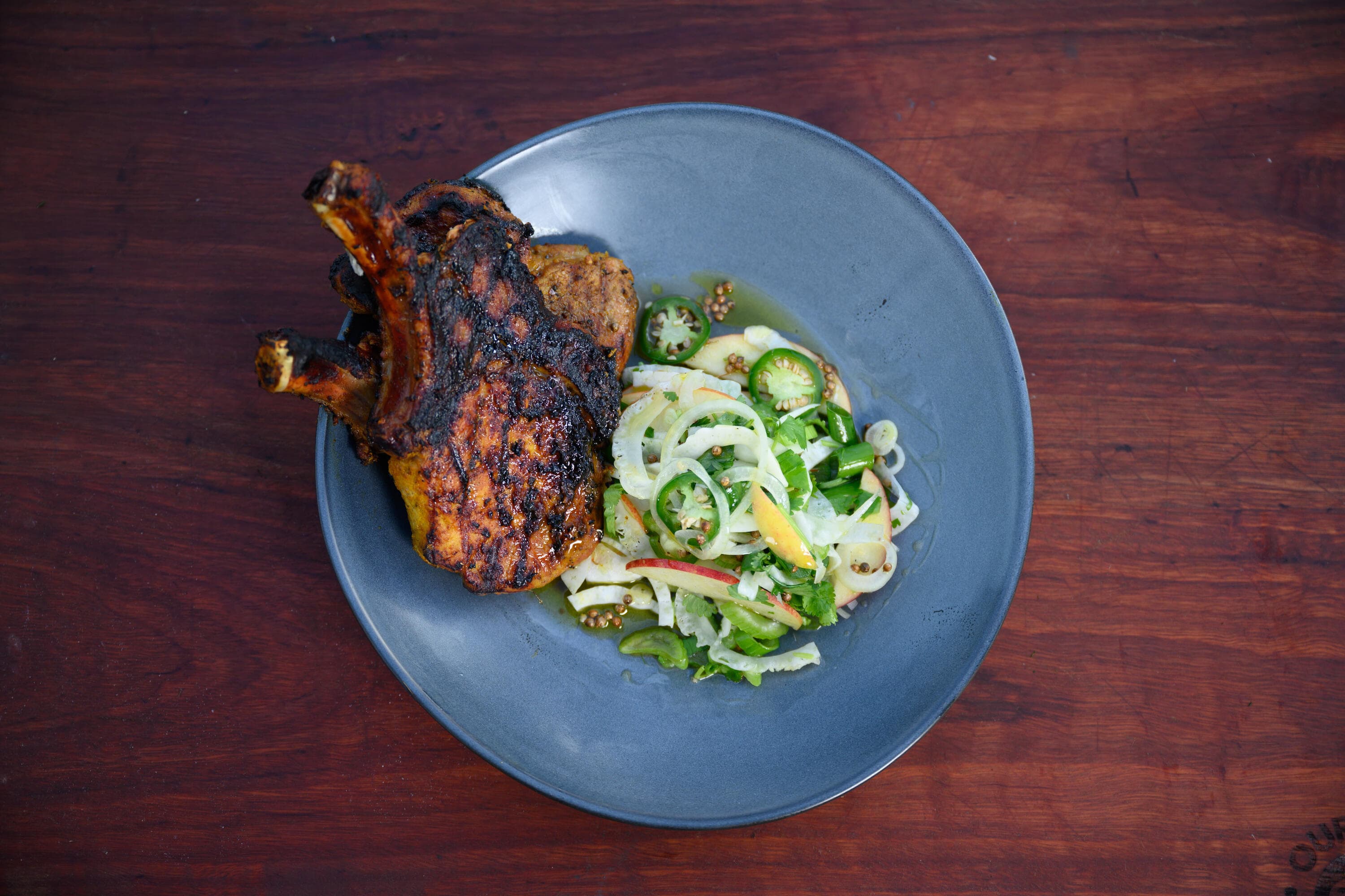 Hayden Quinn’s Apple Juice Turmeric Pork Cutlet w/ Apple + Witlof Salad